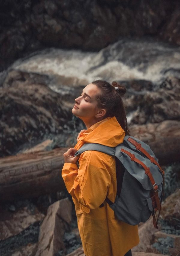 woman-traveller-with-backpack-somewhere-in-forest-near-the-waterfall-1.jpg